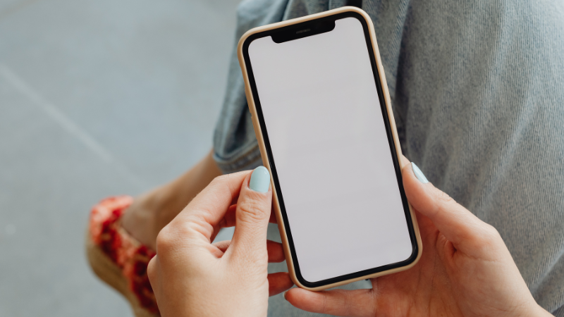 A young woman looking at her phone.