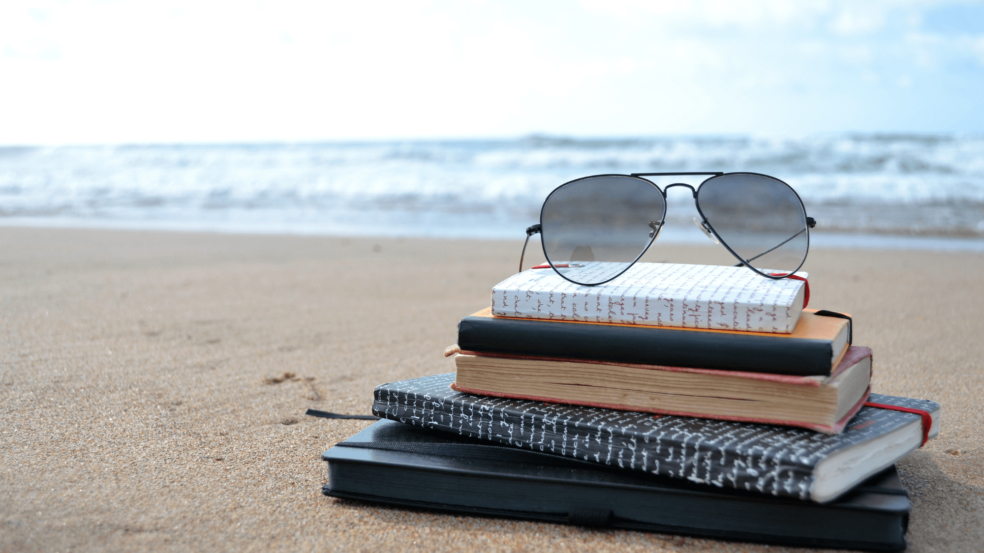 Sunglasses on a Pile of Books at the Beach