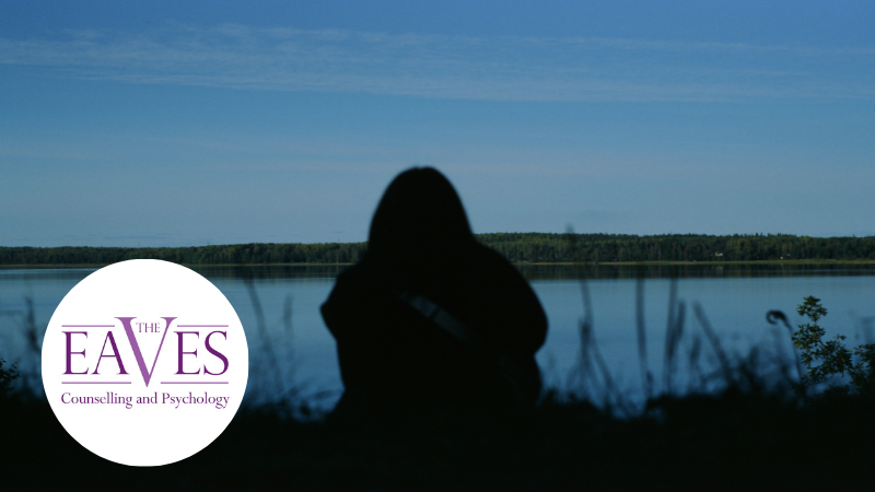 Silhouette of a man standing alone, representing Seasonal Affective Disorder (SAD), low mood, and winter depression.