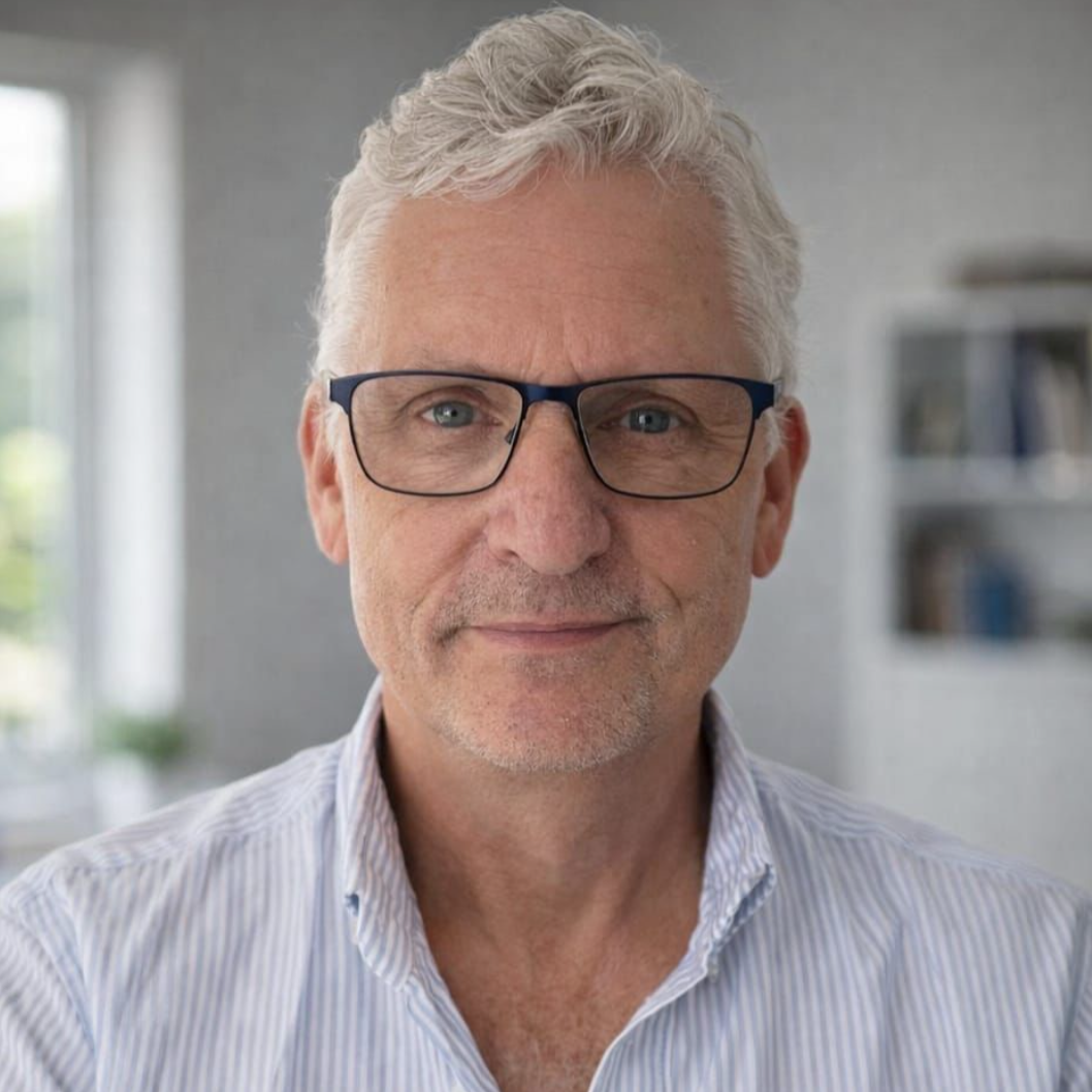 Brian O'Donovan, counsellor and psychotherapist, with grey hair and glasses, offering empathetic and confidential support