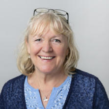 Image of Gillian Clay, an integrative counsellor with light blonde hair and a navy cardigan, supporting clients experiencing relational and attachment difficulties, as well as OCD and anxiety.