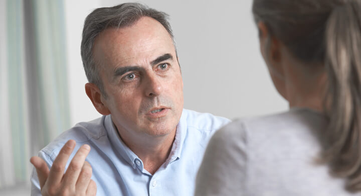 Therapist Talking to Male Patient