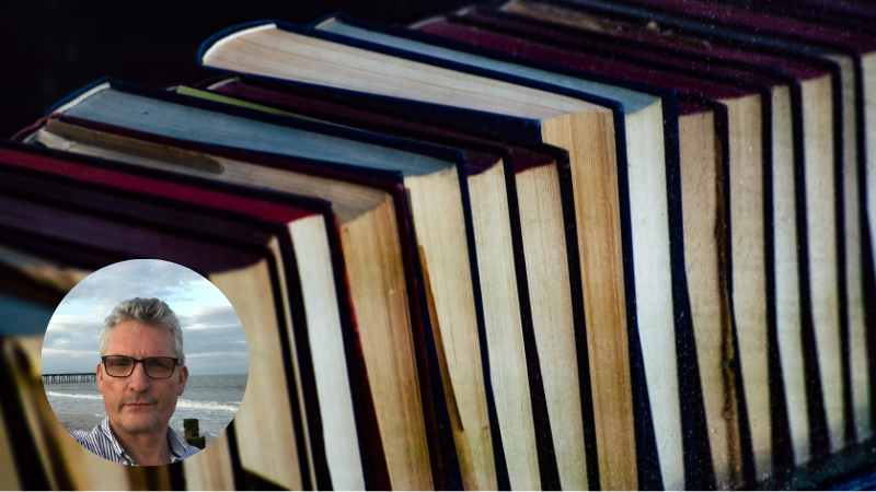 Stacked books representing reading, reflection and psychological insight into trauma, illness and mental health
