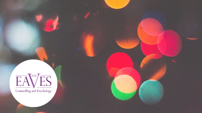 Blurred Pride-coloured street lights at night, symbolising LGBTQ+ visibility, identity and resilience