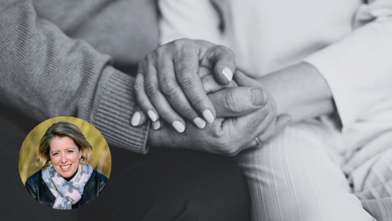Close-up of an older person and another adult holding hands, symbolising compassion, support and therapeutic counselling for later life clients.