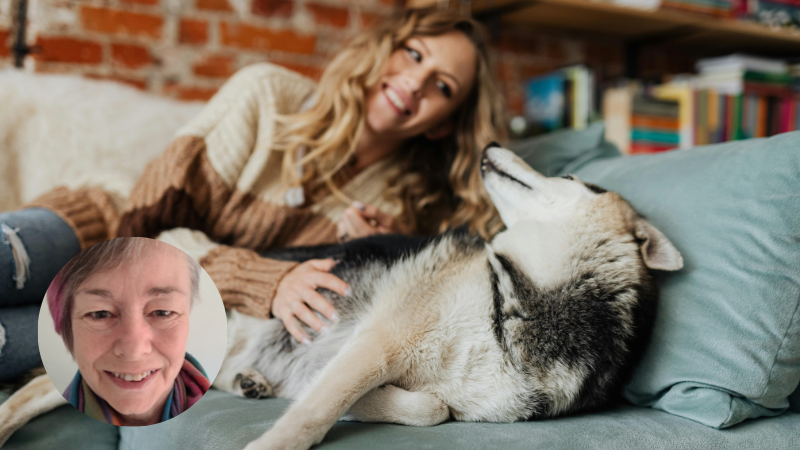 A woman cuddling her dog, showing the calming and supportive bond between humans and animals for mental health and emotional wellbeing.