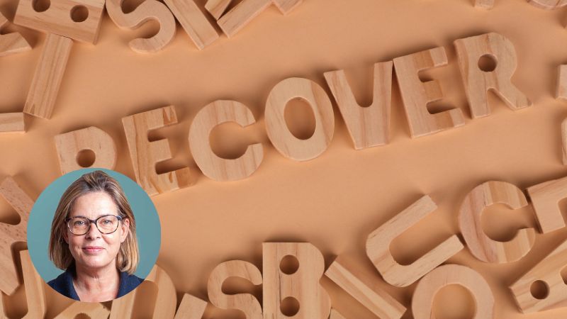 Wooden letter tiles arranged to spell “recover”, symbolising addiction recovery, healing and counselling support.