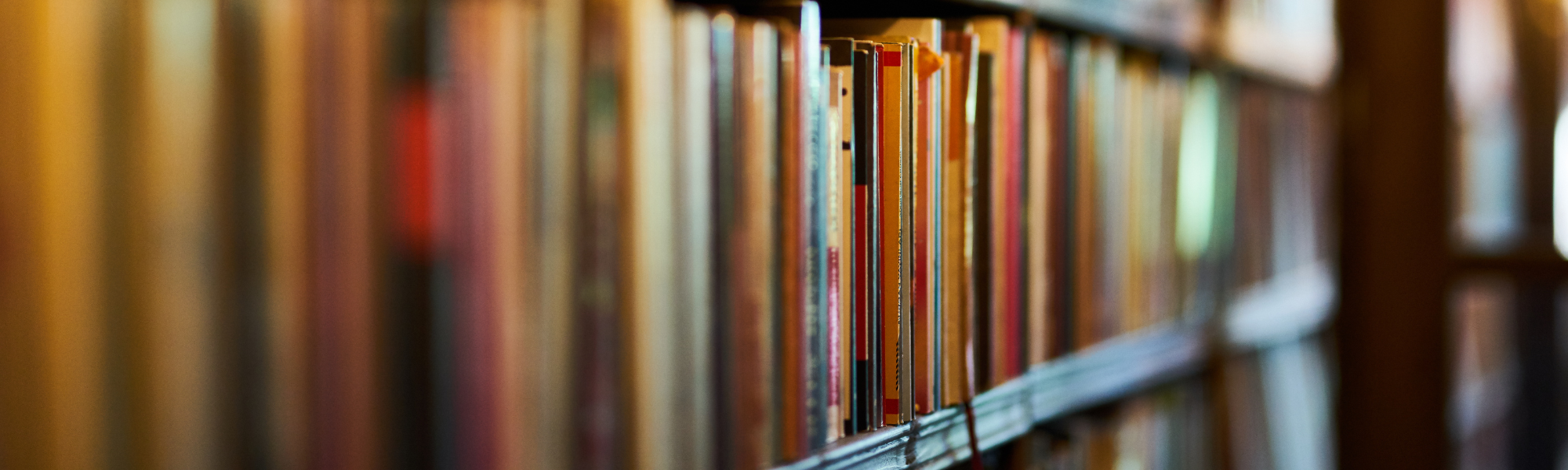 Angled bookshelves symbolising reflection, meaning and psychological insight inspired by Viktor Frankl’s Man’s Search for Meaning.