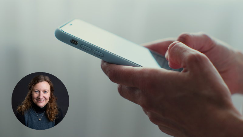 Hands holding a bright blue smartphone, representing messaging and digital communication and its impact on mental health.