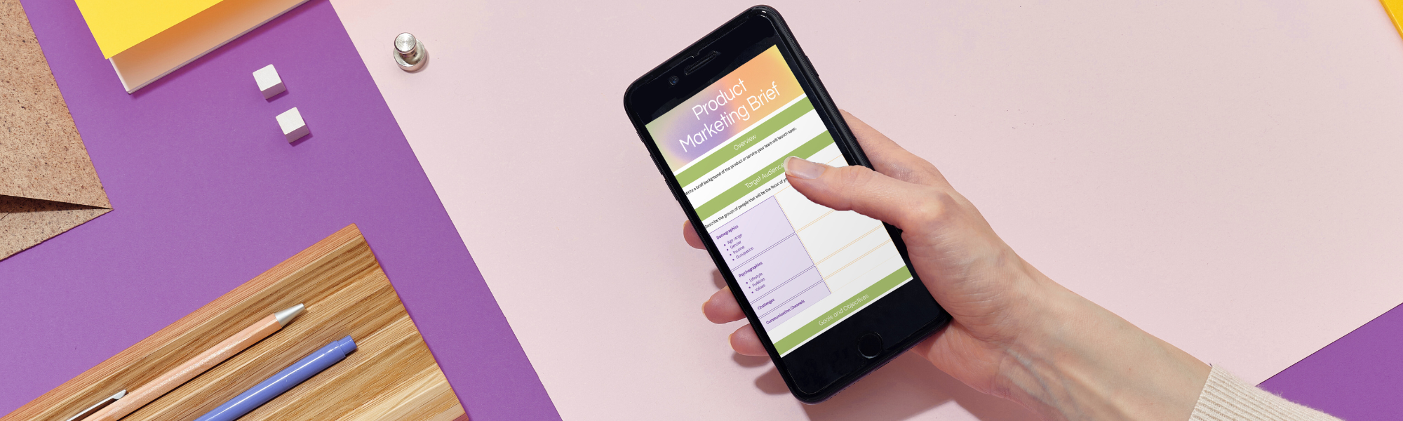 Colourful desk with marketing strategy notes, phone, and pens, representing planning to increase counselling referrals.