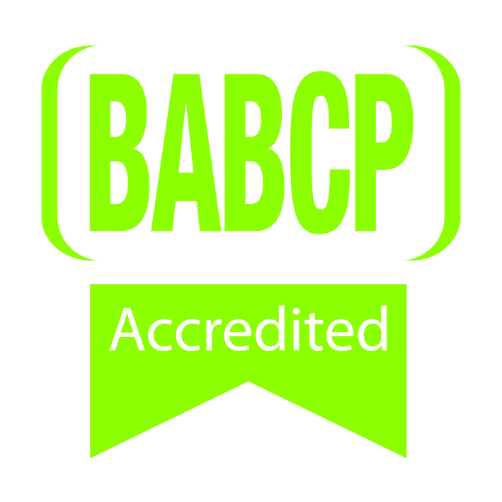 Green logo with large text BABCP in parentheses above a ribbon-shaped banner featuring Accredited in white on a bright green background, designed by Saskia Wills.