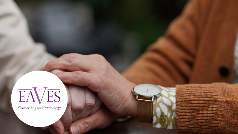Elderly couple holding hands, representing mental health support for older adults in Surrey, with The Eaves Counselling and Psychology logo