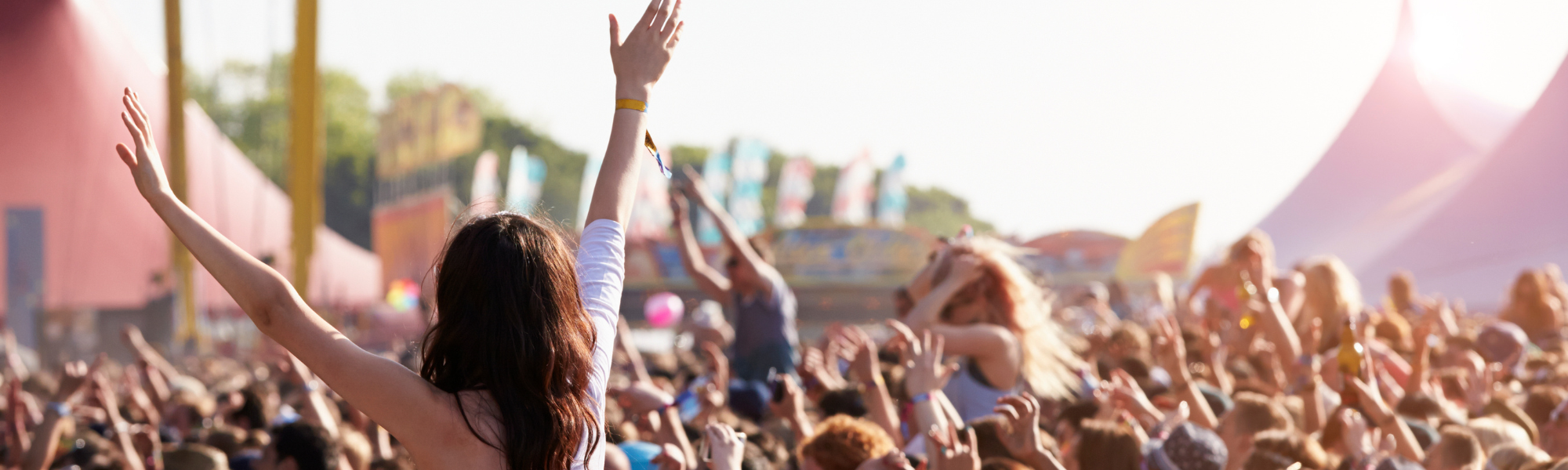 Festival crowd cheering during Lewis Capaldi’s emotional Glastonbury 2025 performance, highlighting his mental health journey.