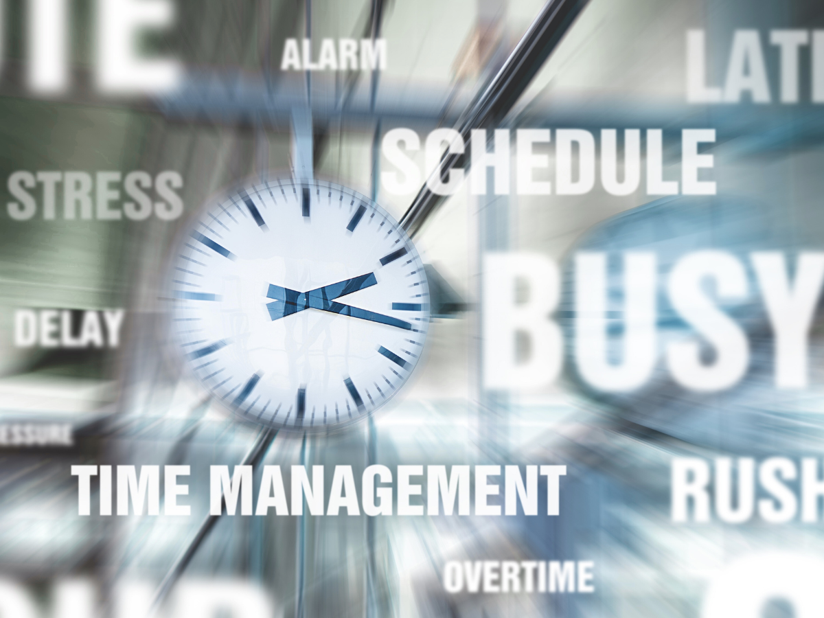 A clock surrounded by words like stress, delay, time management, schedule, and busy – symbolising parental burnout.