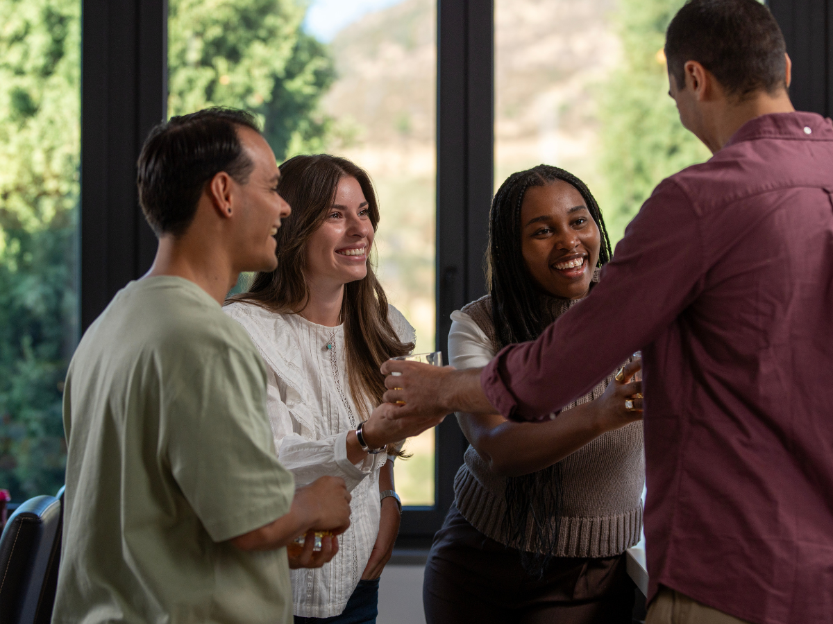 Group of adults laughing and enjoying time together, representing friendship and connection