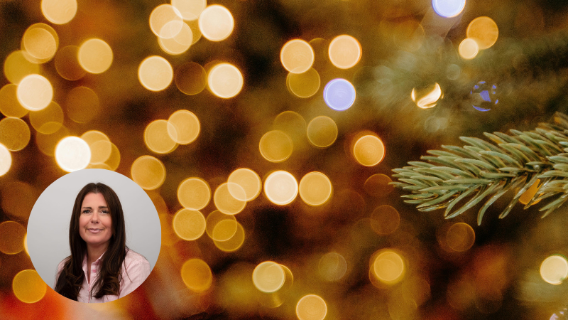 Soft, blurry Christmas lights with a festive tree branch, creating a calm and reflective seasonal atmosphere with circle image of author in bottom left