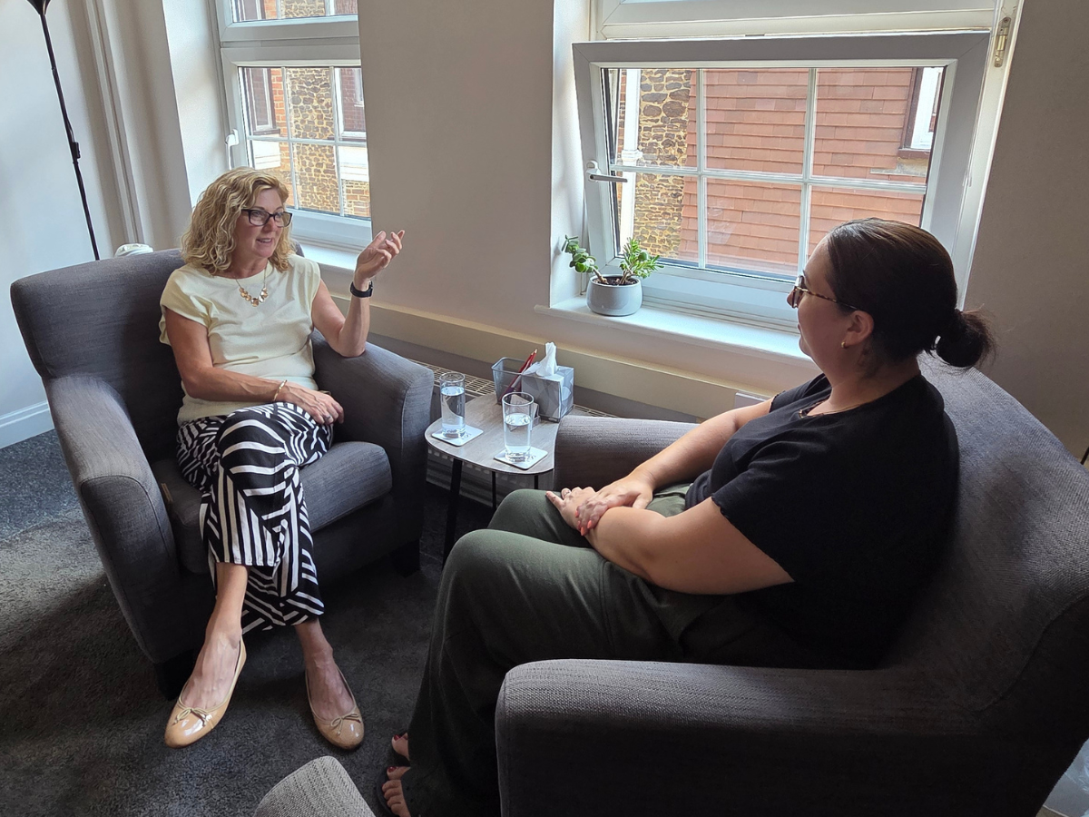 Counsellor receiving supervision in a private therapy room for professional development