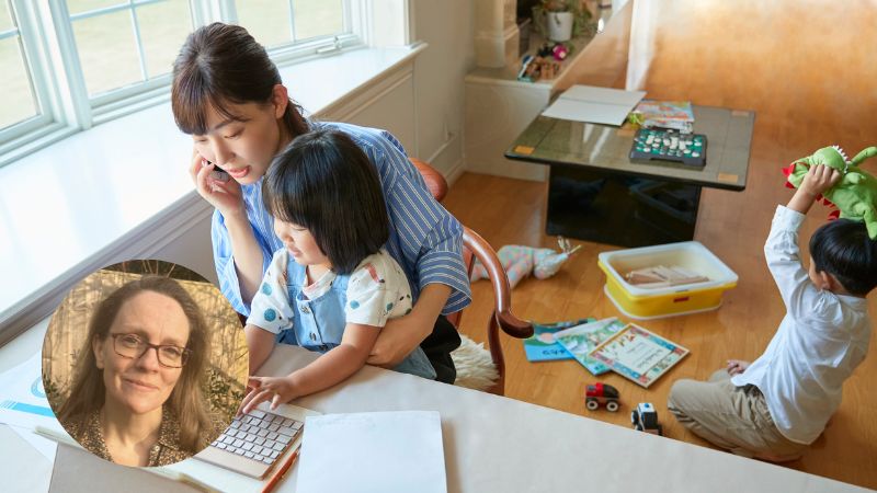 Mom on the phone while holding daughter on her lap, with young son playing on the floor in a cozy living room – illustrating parenting and supporting children with anxiety.