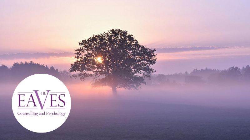 Large, calming tree in a peaceful setting, symbolising stress relief and mental well-being with The Eaves Counselling and Psychology logo bottom left in a circle
