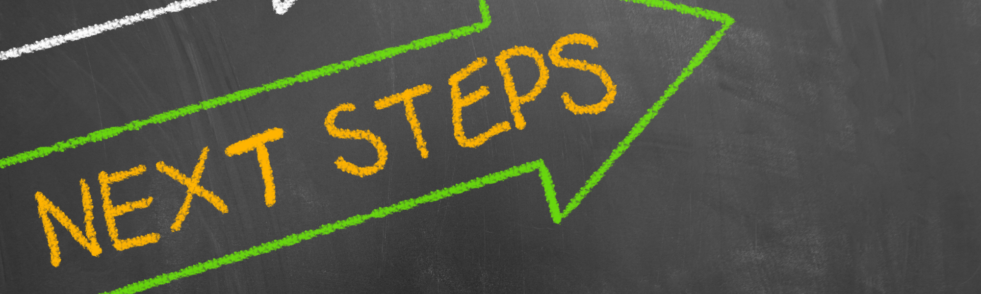 Blackboard with green arrow showing 'Next Steps', symbolizing life alignment and therapeutic guidance