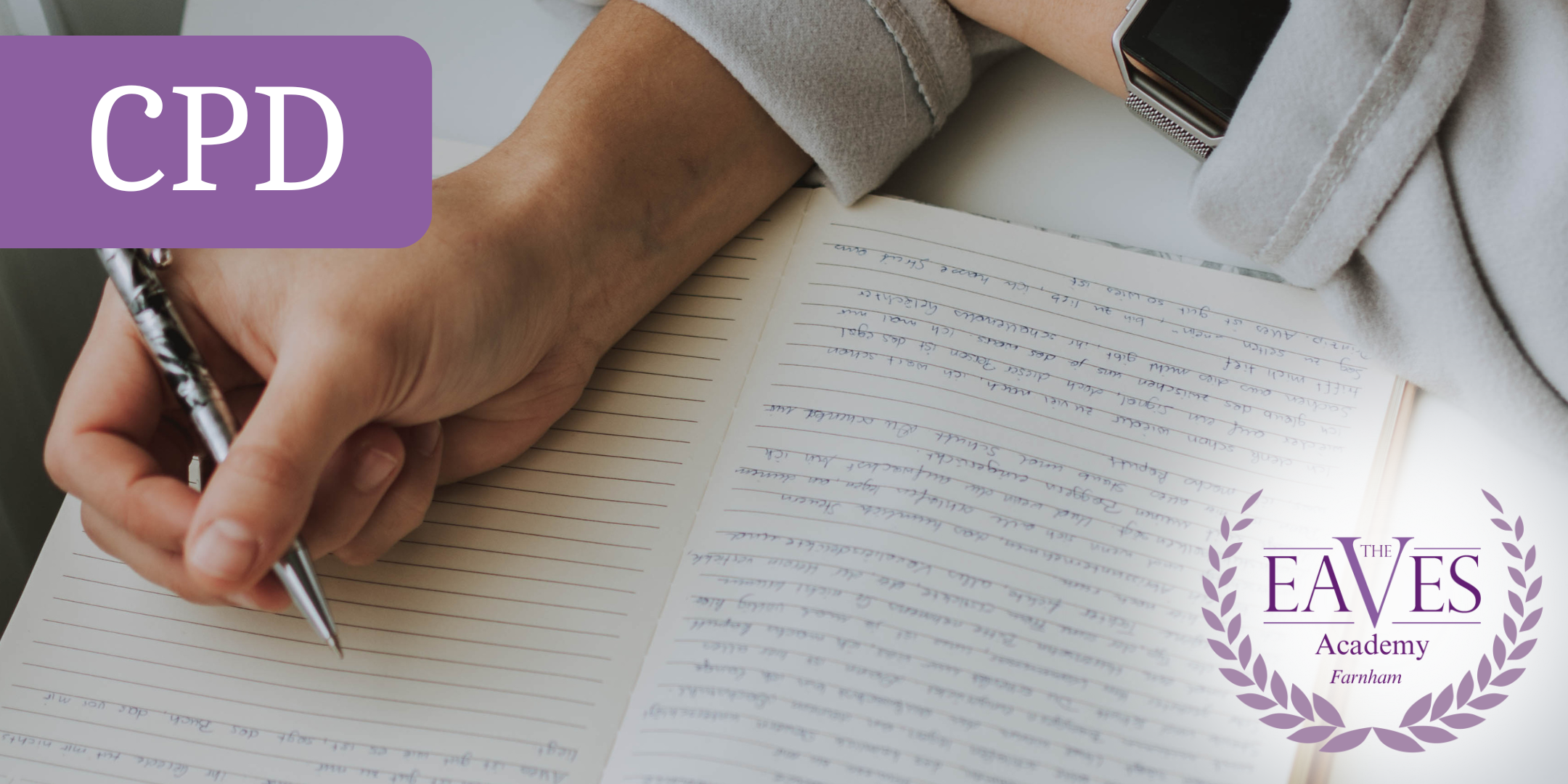 Woman taking notes during a counselling supervision CPD session