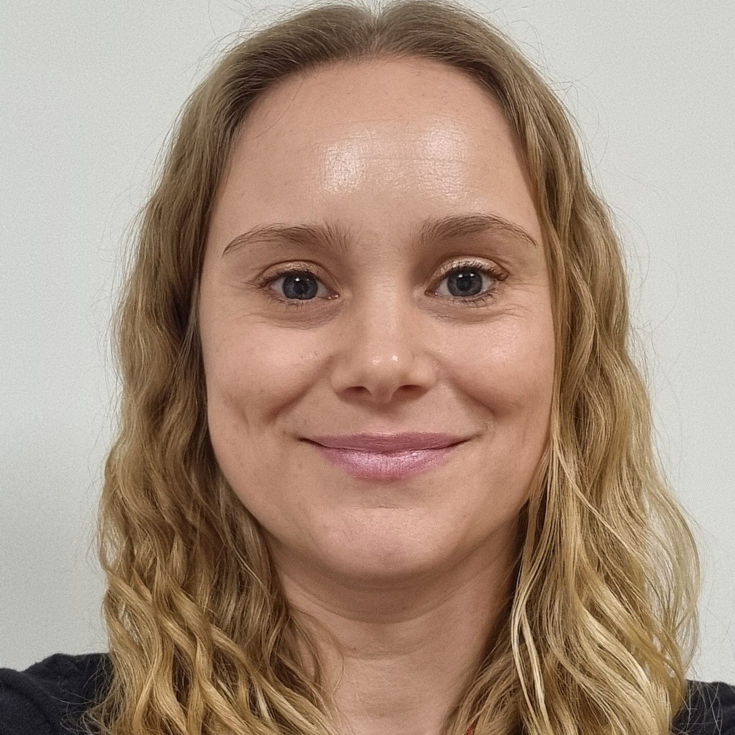 Professional headshot of a Clinical Psychologist specialising in EMDR, CBT, CFT, and ACT, supporting clients aged 16+ with trauma, anxiety, low mood, and bereavement.