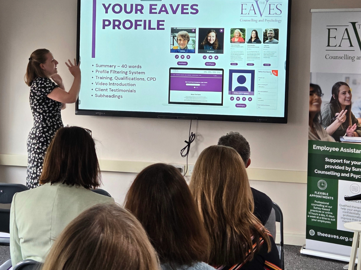 Marketing coordinator presenting the You and Your Practice CPD workshop at The Eaves, pointing to a screen with company banner, audience visible from behind