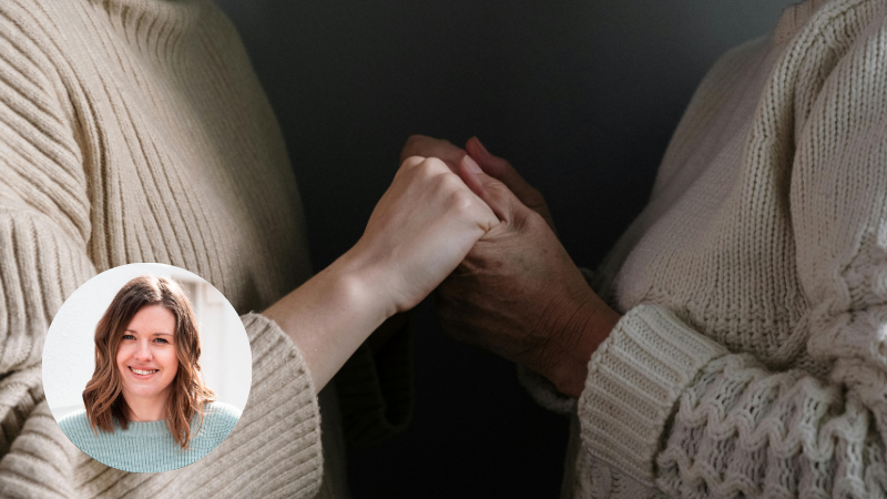 Two women, one middle-aged and one older, standing close together and holding hands in a supportive gesture, representing emotional connection and reassurance. Image of author of the blog Carly Ann in circle bottom right of image.
