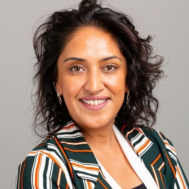 Afirah Azmi, integrative psychotherapist and EMDR practitioner, a woman with dark hair wearing a stripey shirt.