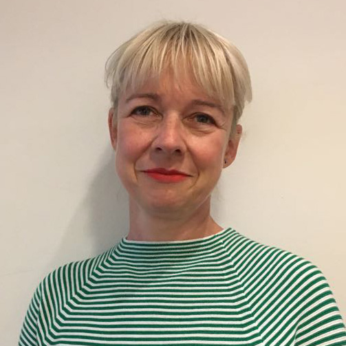 Image of Sabine Fochler, a counsellor and psychotherapist specialising in relationship difficulties in both individuals and couples. Sabine has blonde short hair and is wearing a striped green top.