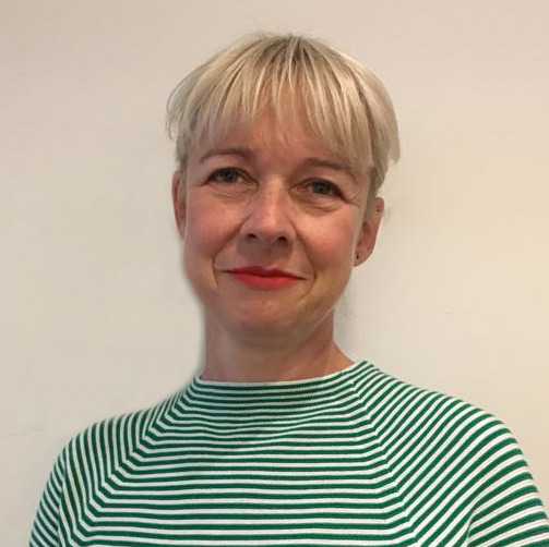 Image of Sabine Fochler, a counsellor and psychotherapist specialising in relationship difficulties in both individuals and couples. Sabine has blonde short hair and is wearing a striped, green top.