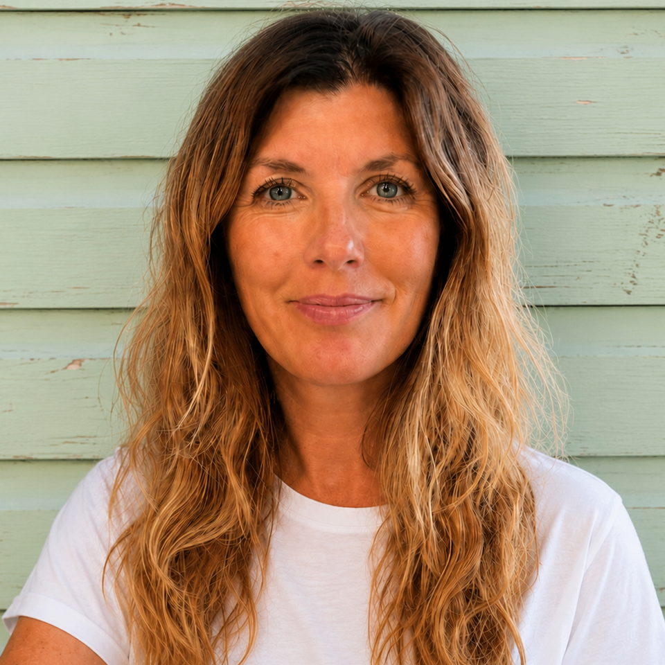 Image of Liz Craven, a registered counsellor and psychotherapist with blonde wavy hair, blue eyes and a white t-shirt.