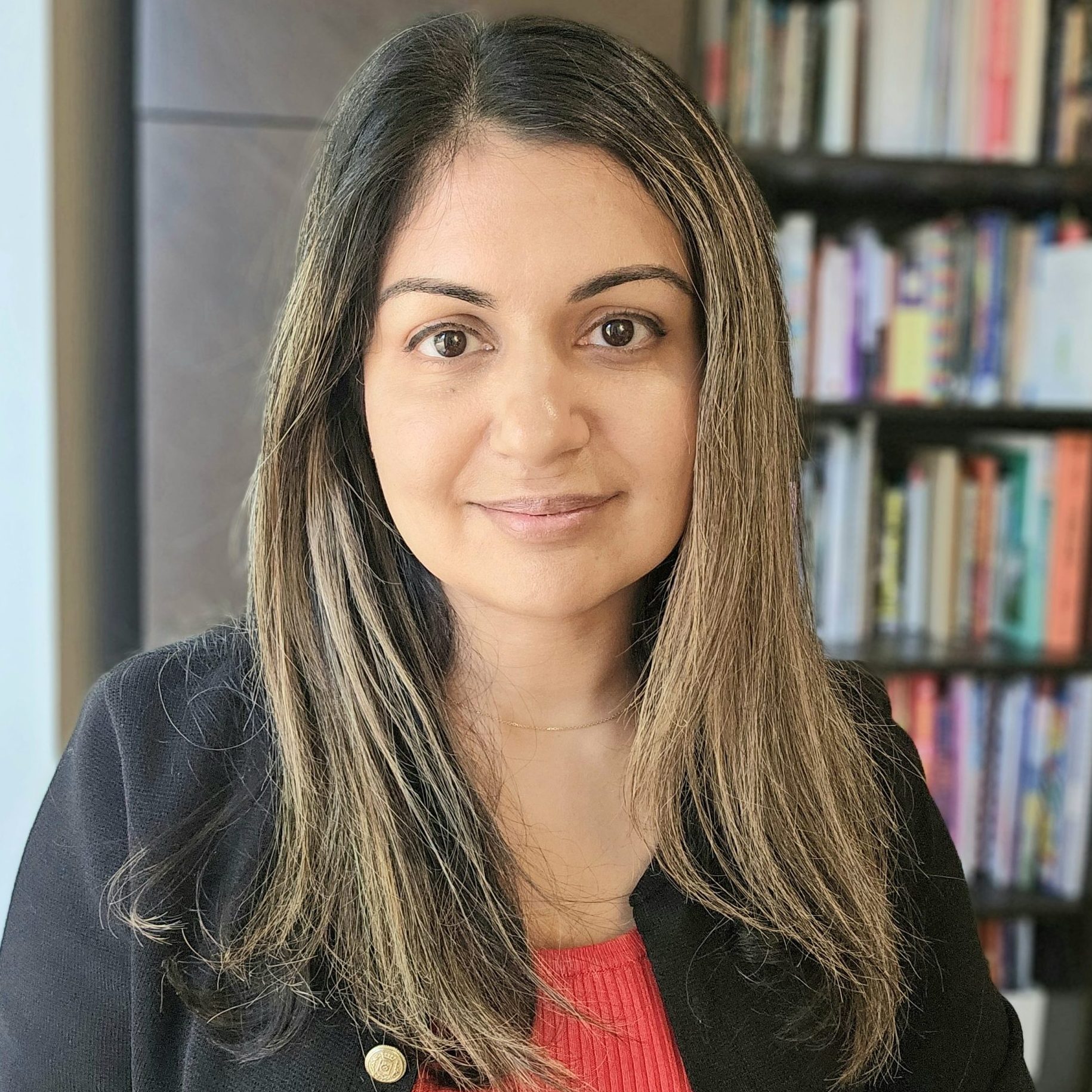 Henal Vyas – Guildford counsellor and psychotherapist offering inclusive support for adults smiling in a professional photograph.